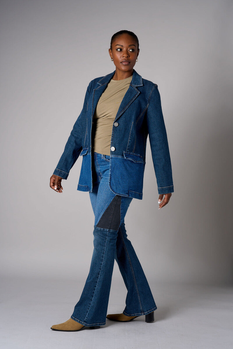 Two tone denim blazer with button front closure and front flap pockets.