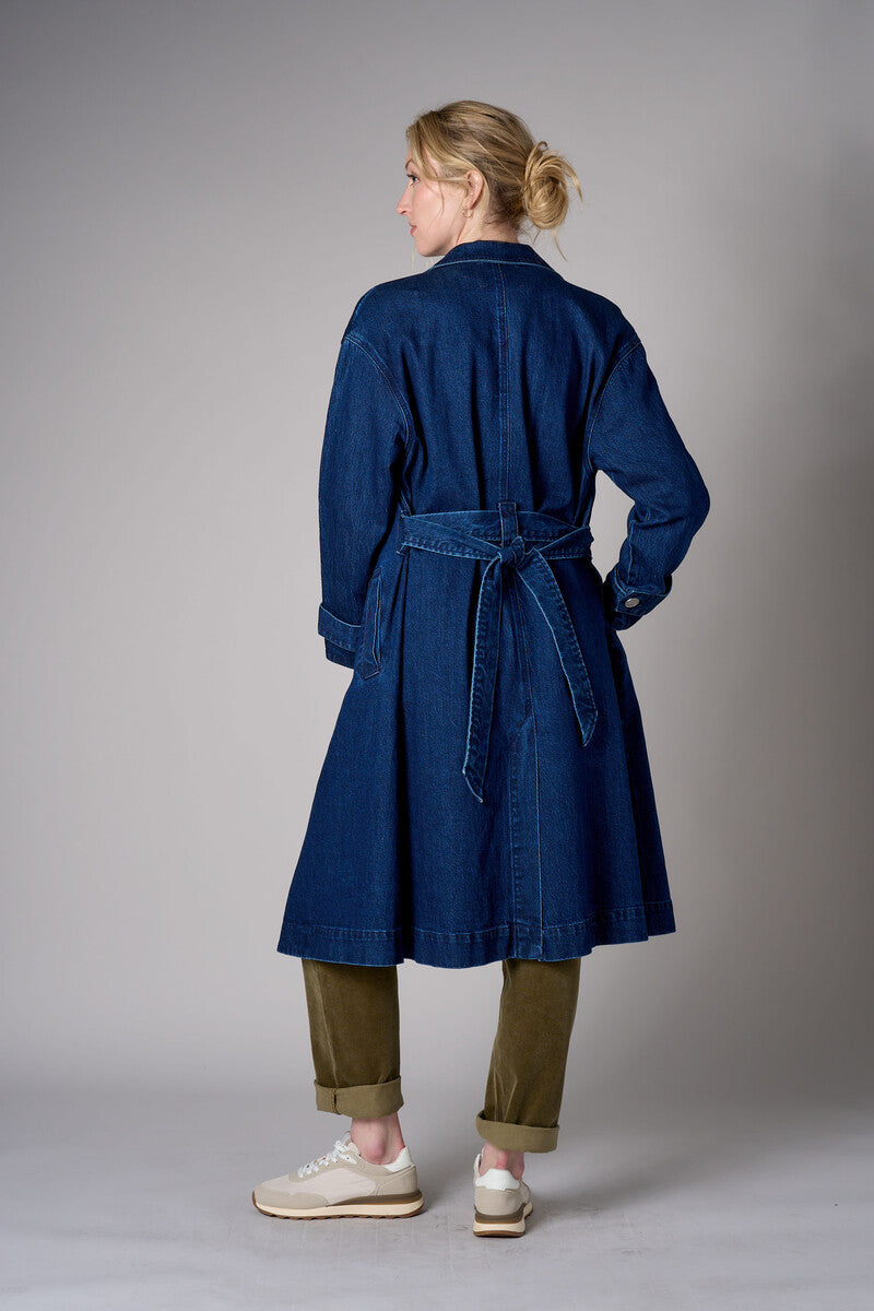 Indigo denim trench coat with a belted waist.