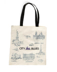Tote bag with cityscape illustrations and 'City Blues' logo on a white background